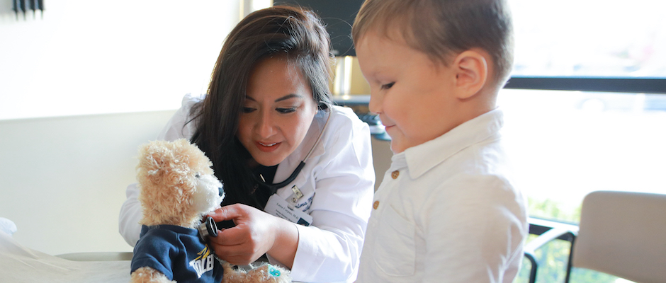 Doctor demonstrating to young patient