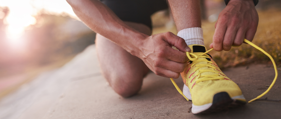 Man tying his shoes