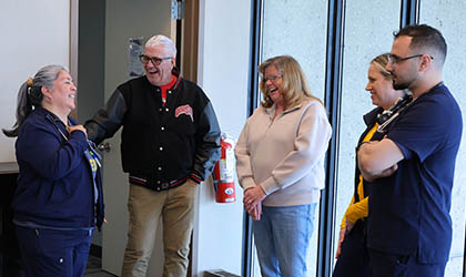 Michael Damschroder and his wife with UToledo Health medical team that treated him after a stroke